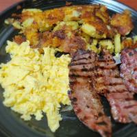 Flank Steak · Marinated flank steak, served with eggs any style, herb potatoes, and one bakery item.