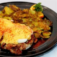 Irish Benedict · Two poached eggs on toasted English muffin with corned beef hash.