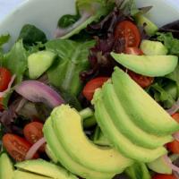 Kahlo Salad · Spring mix with tomatoes, onions, and avocado tossed in a raspberry balsamic dressing. Add e...