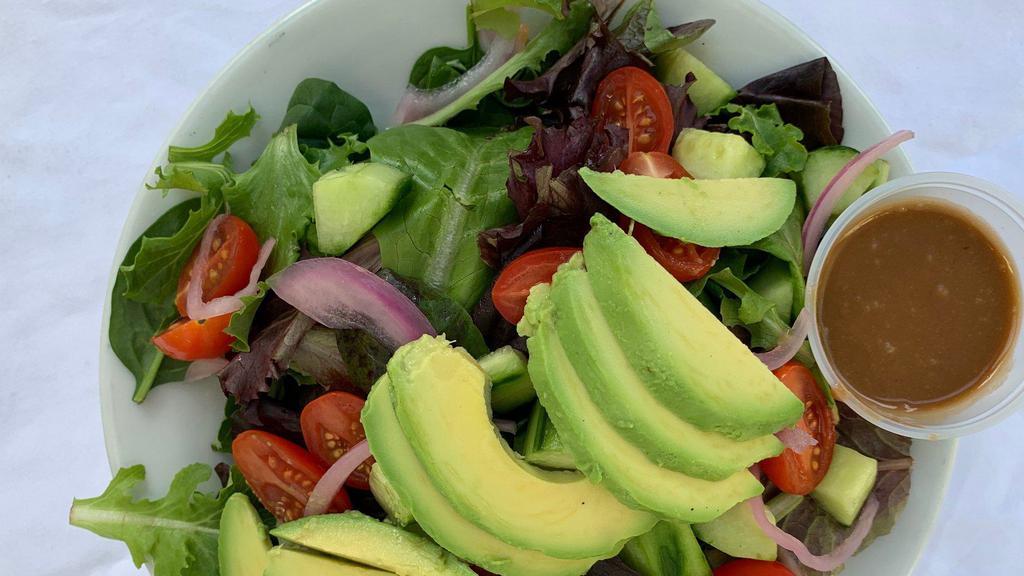Kahlo Salad · Spring mix with tomatoes, onions, and avocado tossed in a raspberry balsamic dressing. Add extra protein for an additional charge.