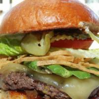 The Houston Burger · A mouth-watering six-ounce burger served with Swiss cheese, BBQ sauce, avocado, tortilla str...