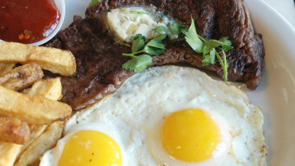 Steak ＆ Eggs Frjtz · A 6oz juicy grilled sirloin flap steak served with a preserved Meyer lemon-shallot butter, Belgian fries and curry ketchup, 2 eggs prepared to your choice.