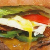 The Sao Paulo Burger · A mouth-watering six-ounce burger served with bacon, cheddar cheese, sliced jalapeño peppers...