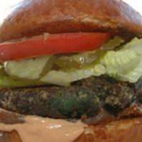 The Sydney Burger · Our vegetarian burger with a black bean porcini cutlet, caramelized red onions, chipotle rem...