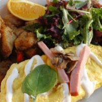 The Whitney · Three egg omelette with Canadian bacon , mushrooms, spinach and creme fraiche served with ho...