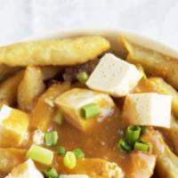Vegetarian Poutine · Vegetarian poutine a mushroom-based poutine sauce with cheddar curds and green onions.