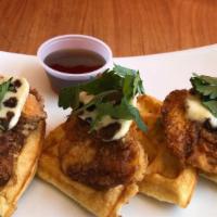 Fried Chicken ＆ Waffle · Buttermilk chicken fried to perfection on a Brussels style waffle. Served with butter and sy...