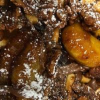 Louise · Caramelized foster bananas,  Nutella, spiced walnuts and bacon. Served with syrup.