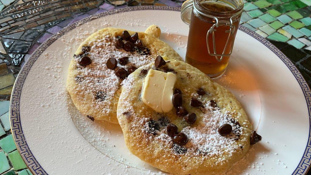 Chocolate Chip Buttermilk Pancakes · 2 large buttermilk pear pancakes with syrup and butter.