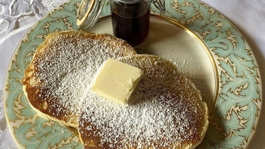 Plain Buttermilk Pancakes · 2 Large buttermilk pancakes served with butter and syrup.
