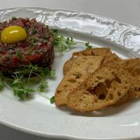 Classic Steak Tartare · quail egg, capers, shallot & crostini