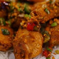 Salt & Pepper Chicken Wings · Spicy. Eight pieces.