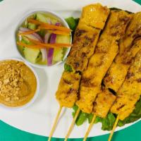 Chicken satay  · Grilled chicken skewers with peanut sauce and cucumber salad on the side