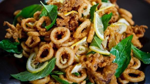 Basil Fried Calamari (ปลาหมึกทอด) · Gluten-free. Lightly battered calamari tossed with Thai Basil and jalapeños  served with sweet chili sauce.