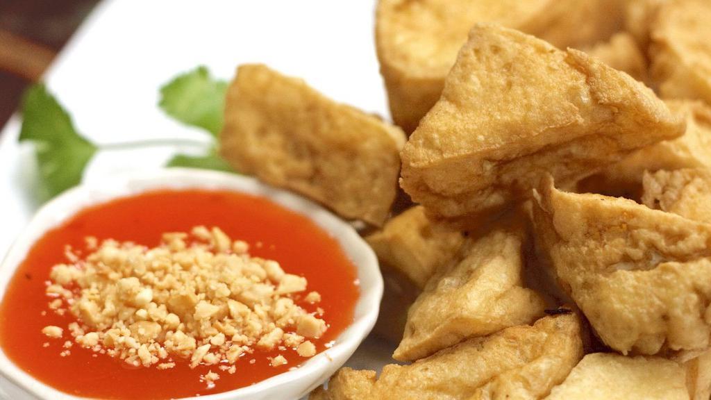 Fried Tofu (เต้าหู้ทอด) · Crispy fried tofu, served with sweet chili sauce