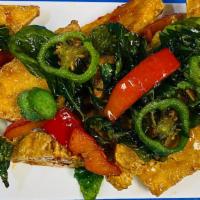 Spicy tofu · Crispy tofu , sautéed with sweet chili sauce, top with crispy sweet basil