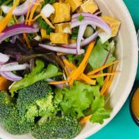 Tofu & veggie bowl · Fresh mixed greens, pumpkin, broccoli , scallion, cucumber and topped with fried non GMO tof...