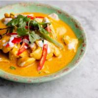 Red Pumpkin Curry (แกงแดง) · Kabocha pumpkin, red bell pepper, green beans simmered in red curry paste and coconut milk