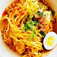 Kao Soi (ข้าวซอย) · Vegan-friendly. Egg noodles in curry broth and boiled free-range egg topped with fried onion...