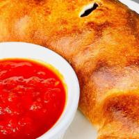 Chicago’s favorite Calzone · Pepperoni, salami, Italian sausage, mushrooms, onions, Bell pepper, ricottra cheese.