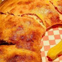 Pollo barbecue calzone · Fresh tomatoes, barbecue sauce, chicken, red onions, ricotta cheese Covered with Michelangel...
