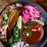 Quesabirria · Quesabirria made with hand made corn tortillas served  with birria topped with onion, cilant...