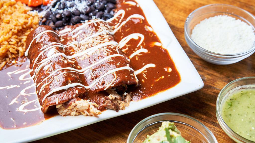 Enchilada Plate · Two enchiladas made to your liking, served with rice and choice of beans.