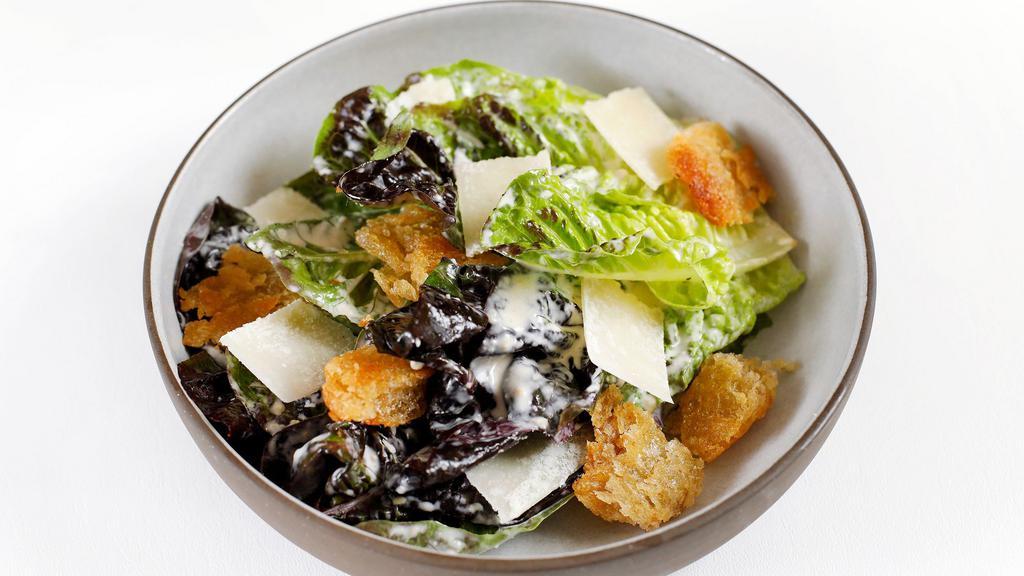 Little Gem Caesar · Classic dressing, torn garlic croutons, and grated Parmesan.
