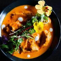 Saffon's Famous Butter Chicken · roasted chicken simmered in makhani sauce (spiced tomato sauce) fenugreek and ginger