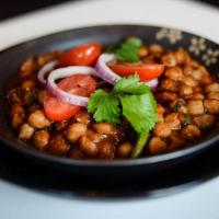 Channa Masala · delicious garbanzo beans, onions,   tomatoes, cooked with green chilies   and a touch of gar...