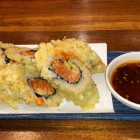 Jumping Salmon · Spicy salmon, shiso, and cucumber rolled and deep fried served with a house special sweet an...