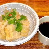 Agedashi Tofu · Fried tofu in tempura sauce topped w/ bonito flakes and scallions.