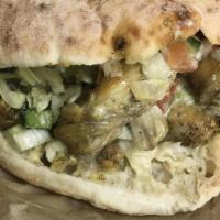 CHICKEN PITA SANDWICH AND WRAPS · Boneless chicken thigh meat cooked with spices or ground chicken cooked with onions, bell pe...