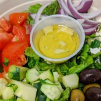Greek Salad · Lettuce, Tomatoes, Cucumbers, Red Onions and Olives. Served with choice of your dressing.