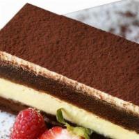 Tiramisu Cake · Ladyfingers (savoiardi) dipped in coffee, layered with a whipped mixture of eggs, sugar, and...
