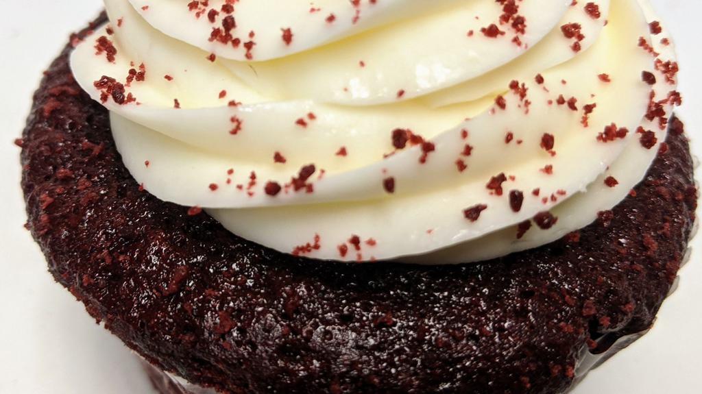 Red Velvet cupcake · Red velvet cake with luscious cream cheese frosting .