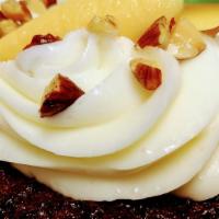 Carrot cupcake · Moist carrot cake topped with luscious cream cheese frosting .