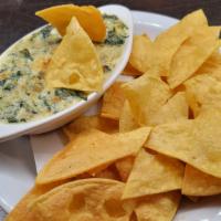 Spinach Artichoke Dip · Creamy parmesan and pepper jack béchamel sauce, gratinated. golden brown with panko bread cr...
