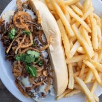 Western Cheesesteak · Bacon, fried onions, provolone cheese, BBQ sauce, cilantro, and ranch dressing.