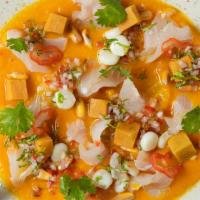 Peruvian Style Sashimi · Sashimi cuts of fresh white fish, finely chopped red onions, limo chili and cilantro, soft s...