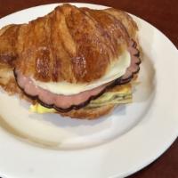 Breakfast Sandwiches · Eggs, ham and provolone cheese toasted together in a butter croissant.