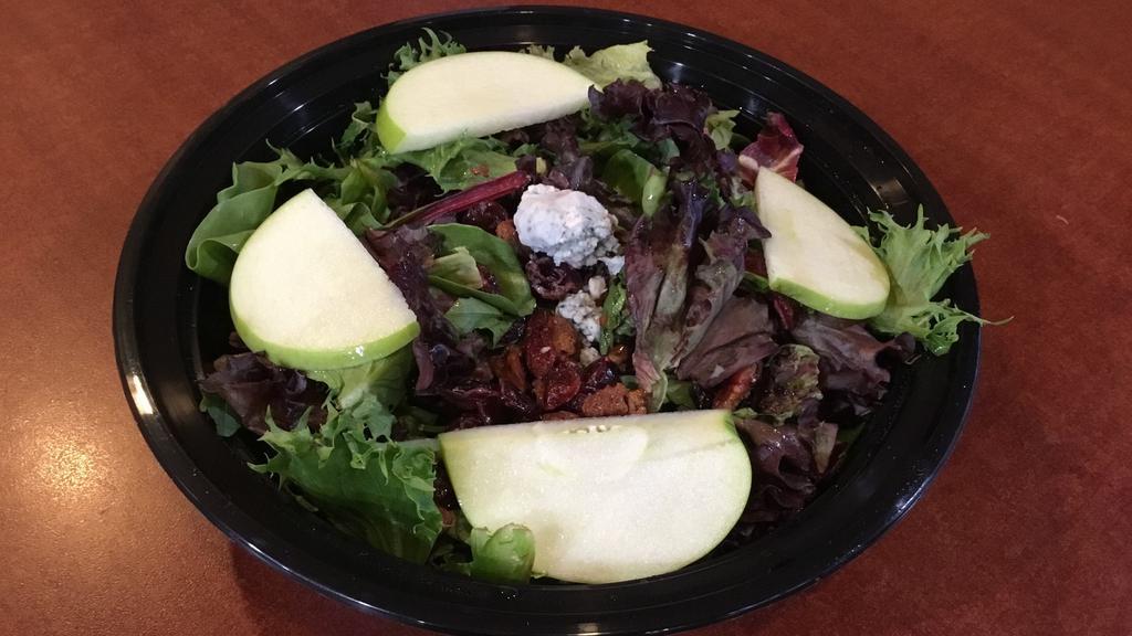 Harvest Salad · Mixed spring greens, apple slices, dried cranberries, blue cheese, and candied walnuts with balsamic vinaigrette dressing.