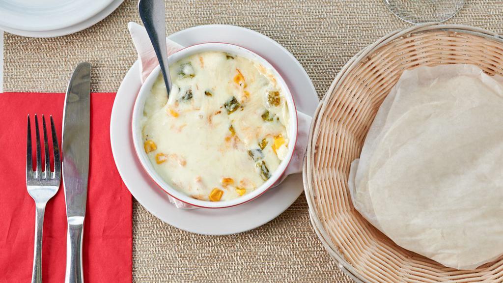 Queso Fundido · Melted Oaxaca cheese with rajas, corn.