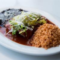 Mole Enchiladas · Corn tortilla, mozzarella cheese, sour cream, and choice of meat. served with red rice and b...