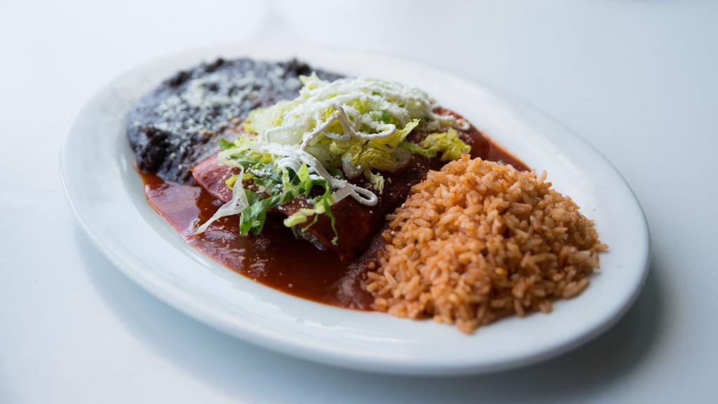 Mole Enchiladas · Corn tortilla, mozzarella cheese, sour cream, and choice of meat. served with red rice and black beans.