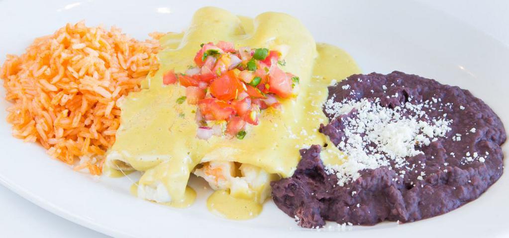Suizas De Mariscos · Corn tortilla filled with red snapper, shrimp, crab, mozzarella cheese, topped with green poblano cream sauce, served with red rice & black beans.
