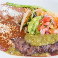 Carne A La Tampiquena · Grilled skirt steak served with mole enchiladas, guacamole, onions, rajas poblanas, pinto be...