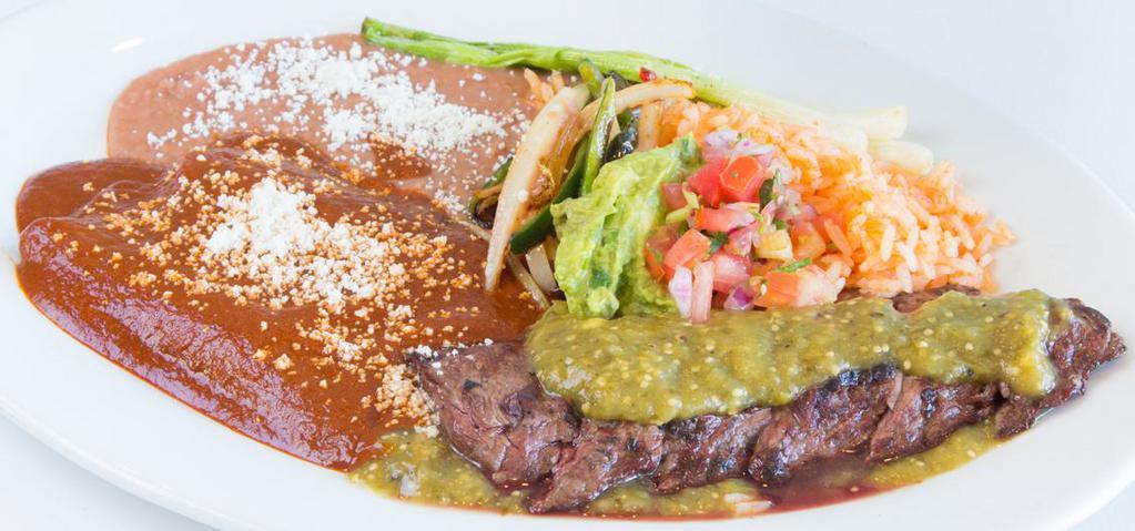 Carne A La Tampiquena · Grilled skirt steak served with mole enchiladas, guacamole, onions, rajas poblanas, pinto beans, red rice.