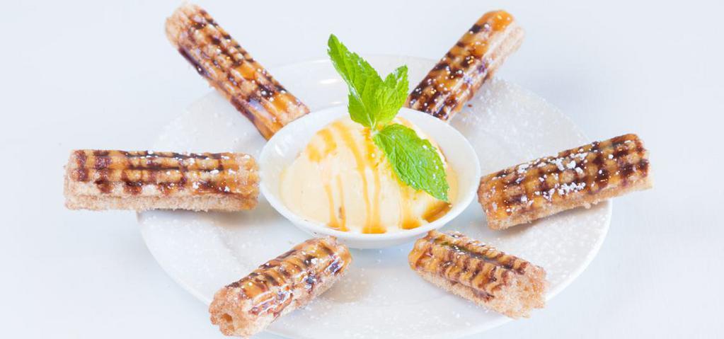Churros · Deep-Fried sweet dough rolled in cinnamon and brown sugar, served with vanilla ice cream.