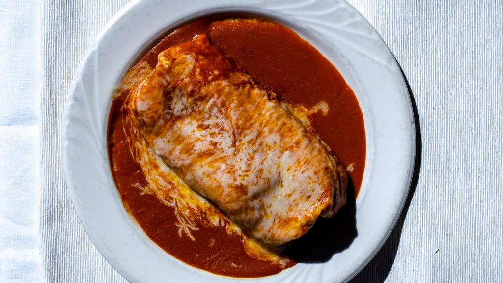 Regular Burrito Olé · A flour tortilla filled with refried beans, rice and your choice of one filling listed below, top it off with our delicious red enchilada sauce and cheese, then broil it till melted and piping hot.
